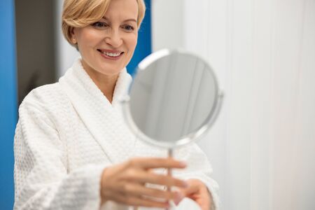 Woman takes care about her skin and doing cosmetology and lazer proceduresの写真素材