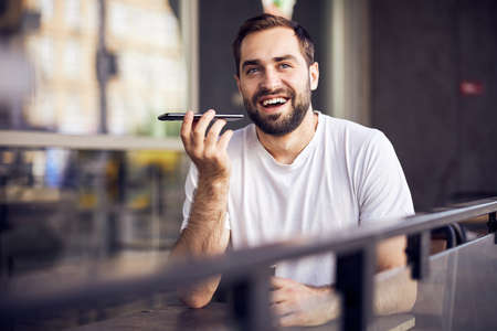 Man from behind  with phone in mask
