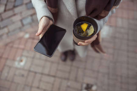 Ypung lady working in cafe and walking in cityの写真素材