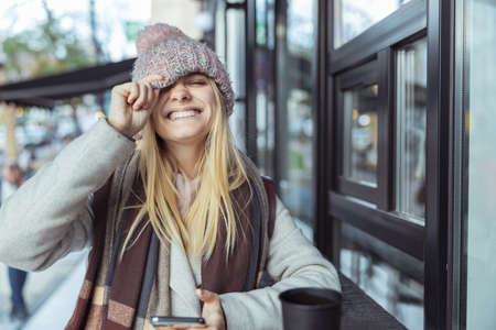 Ypung lady working in cafe and walking in city