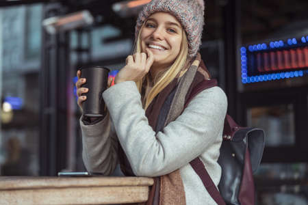 Ypung lady working in cafe and walking in city
