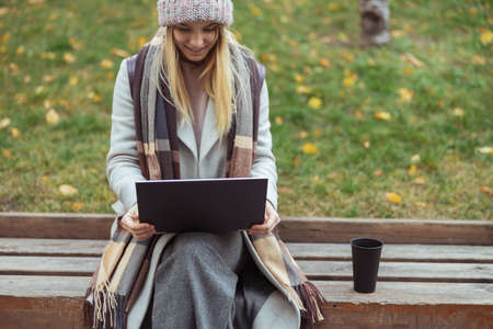 Ypung lady working in cafe and walking in cityの写真素材