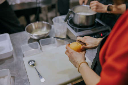 People are preparing delicious meals at cooking masterclassの写真素材