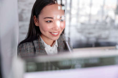 Asian woman working in IT office