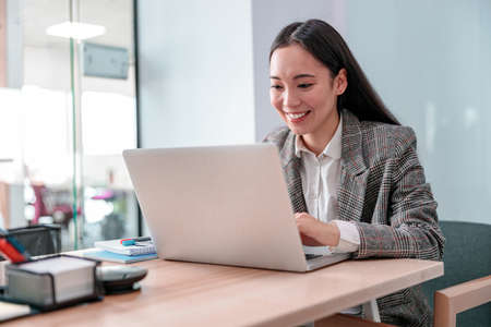 Asian woman working in IT office