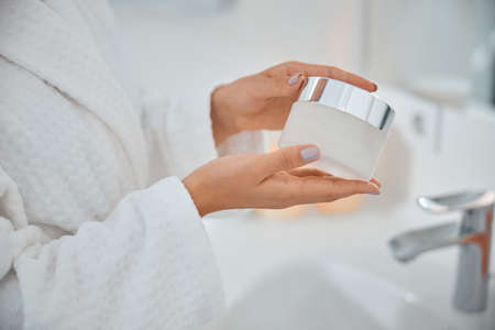 Beautiful healthy smiling caucasian woman is doing beauty procedures at spa and healthcare salonの写真素材