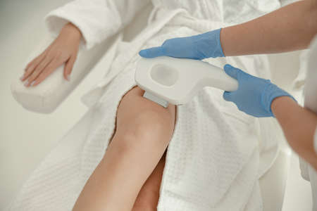 Beautiful healthy smiling caucasian woman is doing beauty procedures at spa and healthcare salon