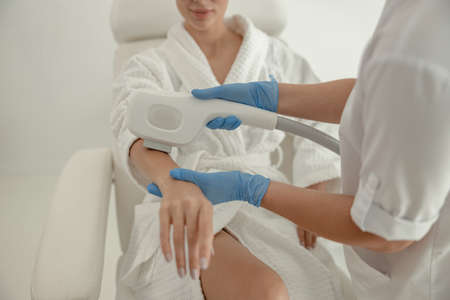Beautiful healthy smiling caucasian woman is doing beauty procedures at spa and healthcare salon