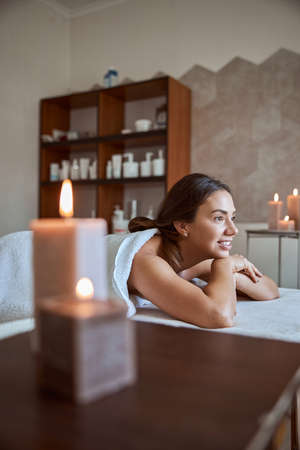 Young atractive female in massage salon is having beauty and healthcare procedures