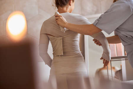 Young atractive female in massage salon is having beauty and healthcare proceduresの写真素材