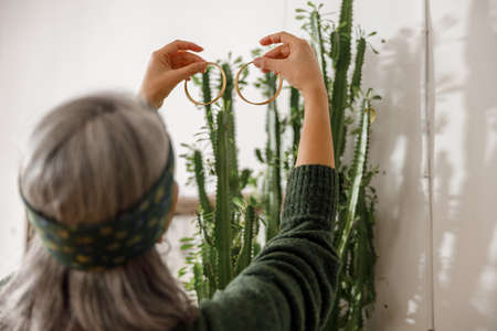 matured beautiful asian paled hair woman at homeの写真素材