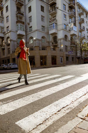 Mature pale hair stylish woman lifestyle portrait outdoors in cityの写真素材