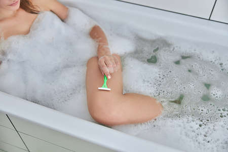 Young female with natural healthy fresh skin at home bathroom