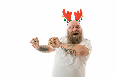 Emotional fat funny and tattooed man with food isolated on a white backgroundの写真素材