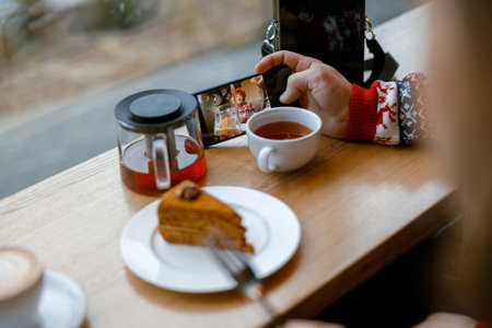 cheerful happy and beautiful caucasian couple having date in a cafeの写真素材