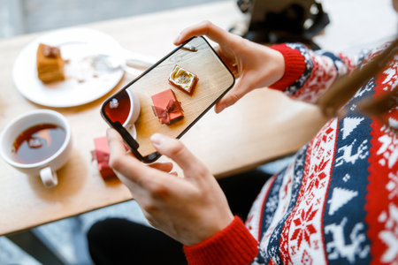 cheerful happy and beautiful caucasian lady is resting in a cozy cafe teraceの写真素材