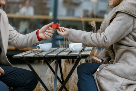 cheerful happy and beautiful caucasian couple having date together outdoorsの写真素材