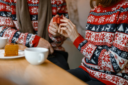 cheerful happy and beautiful caucasian couple having date in a cafeの写真素材