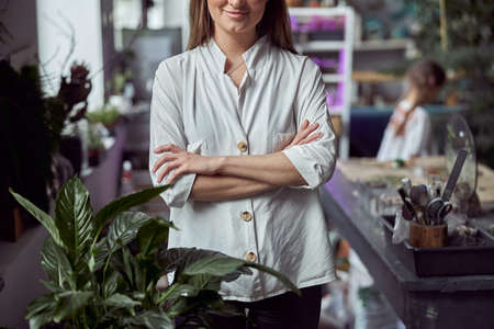 Portrait of caucasian female florist in its own florist shopの写真素材