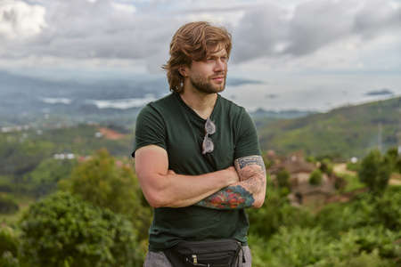 Beautiful young man caucasian tourist in equatorial africa mauntains