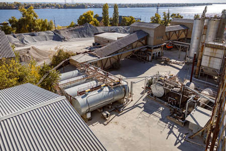 Industrial site near river with facility complex