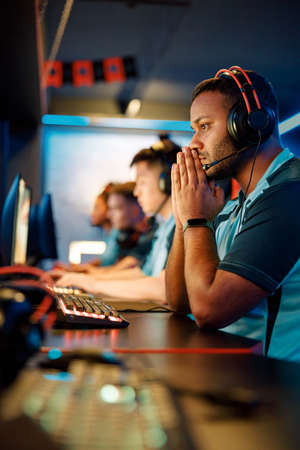 Professional gamer participates in team play in cyber clubの写真素材