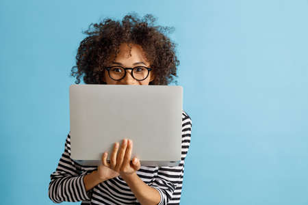 African young woman using laptop in studioの写真素材
