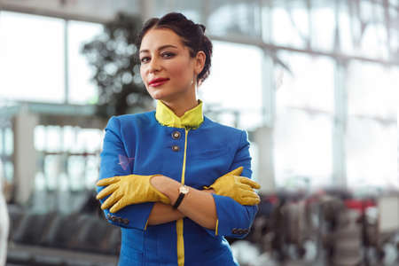 Flight attendant or stewardess standing in airport terminalの写真素材