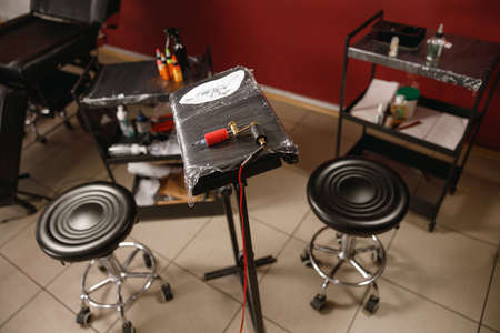 Photo of tattoo equipment details on artist working place
