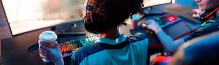 Woman esports gamer performing in gaming tournament in cyber clubの写真素材