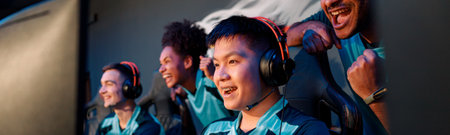 Young Asian man gaming with his friends in cyber club