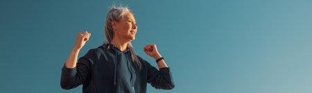 Woman training on warm day by the coastの写真素材