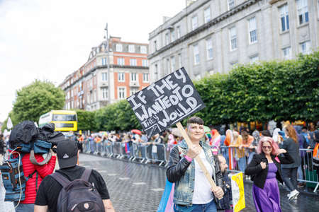 Dublin, Ireland, June 25th 2022. Ireland pride 2022 parade with people walking on one of the main city streetのeditorial素材