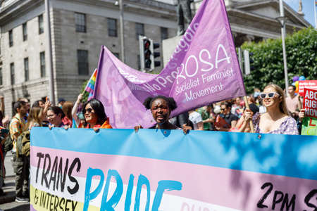 Dublin, Ireland, June 25th 2022. Ireland pride 2022 parade with people walking on one of the main city streetのeditorial素材