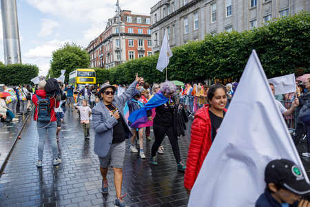 Dublin, Ireland, June 25th 2022. Ireland pride 2022 parade with people walking on one of the main city streetのeditorial素材