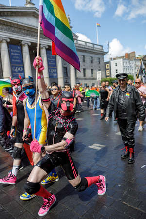 Dublin, Ireland, June 25th 2022. Ireland pride 2022 parade with people walking on one of the main city streetのeditorial素材