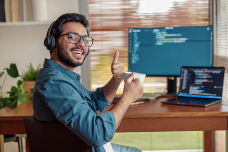 Male freelancer making new project as web designer or programmer on his computer at home officeの写真素材