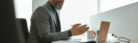 Caucasian man working online in a modern office