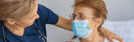 Doctor supporting a sick patient before medical procedures in a hospital roomの写真素材