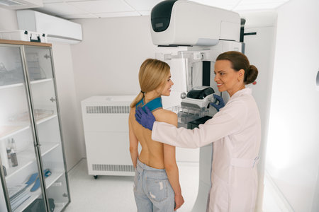 Female radiologist doing mammogram x ray for young woman to check for breast cancerの写真素材