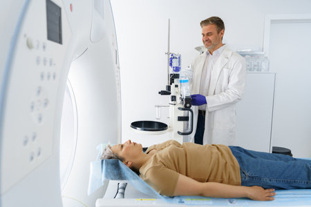 Doctor and female patient in the room of computed tomography at hospital. Healthcare conceptの写真素材