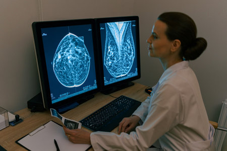 Smiling professional doctor radiologist analyzing scan MRI images in medical center