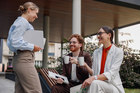 A productive outdoor business meeting held with colleagues to foster collaboration and creativityの写真素材