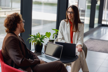 Engaging Business Meeting Held in a Modern Office Environment for Professionals and Entrepreneursの写真素材