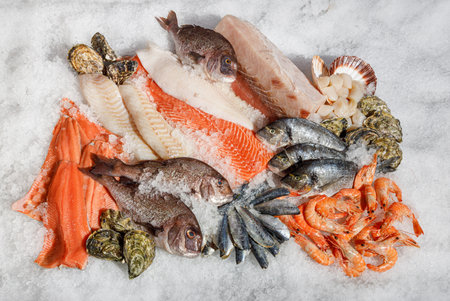 A Wonderful Assortment of Fresh Seafood Presented on Ice for Delicious Culinary Delightsの写真素材