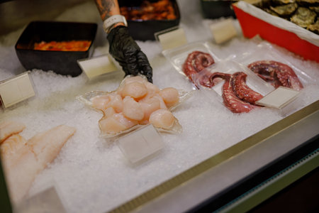 A Fresh Seafood Assortment Artfully Arranged on an Ice Display for Dining Delightの写真素材