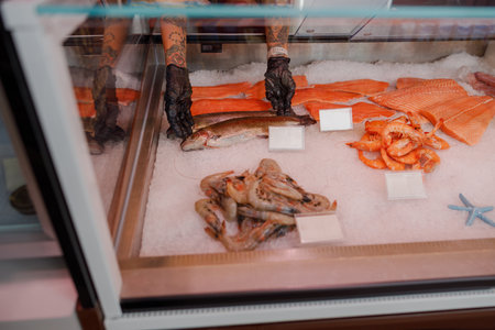A Fresh and Colorful Seafood Display Featuring Various Fish, Octopus, and Salmonの写真素材