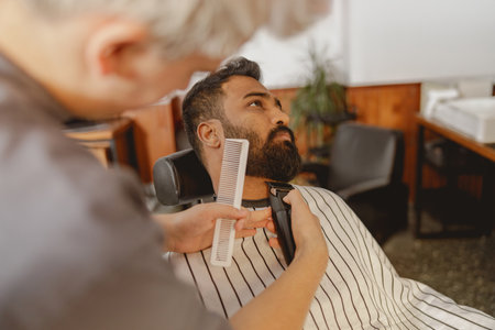 A Barber Grooming Session in a Stylish Modern Barbershop for a Perfect Look and Experienceの写真素材
