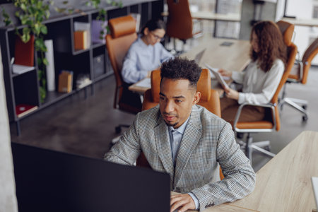 A modern workspace featuring professionals actively engaged in collaborative and innovative workの写真素材