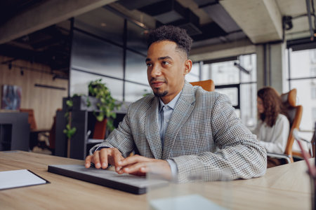 A professional working in a modern office, demonstrating productivity and creativityの写真素材